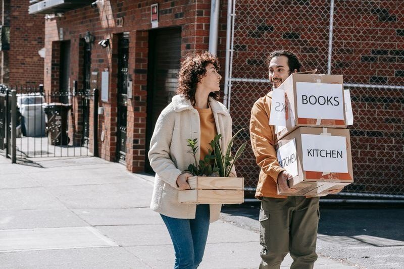 TicTac Relocation movers carrying boxes